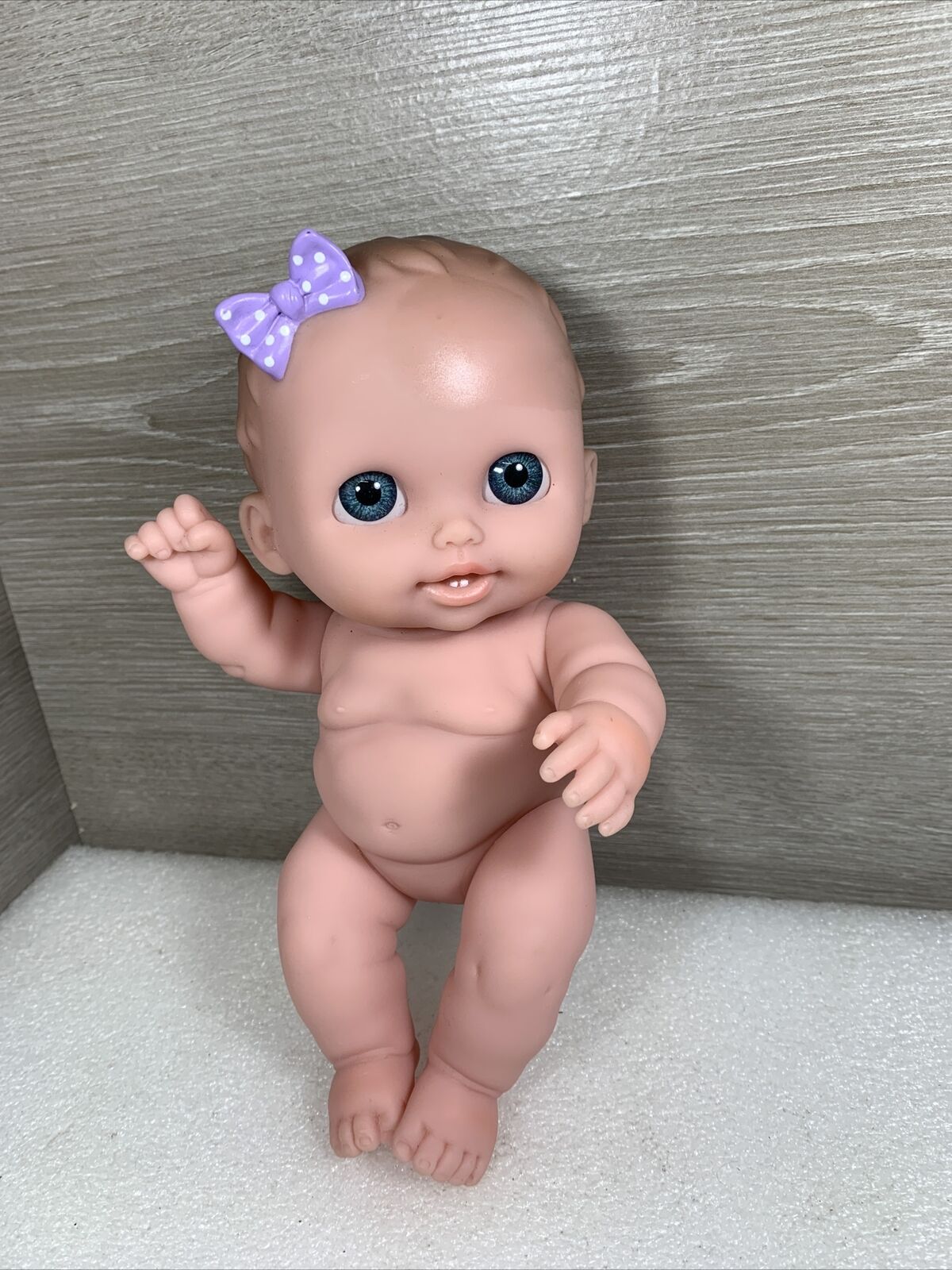Berenguer Baby Doll 19-14 Blue Acrylic Inset Eyes 9" Brown Hair Purple Bow